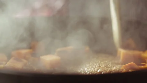 Pumpkin cubes and balsamic vinegar cooked and mixed in a pan Stock Footage 135057344
