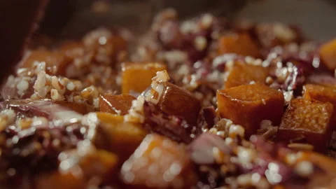 Pumpkin cubes mixed with red rice and radicchio Stock Footage 135075320