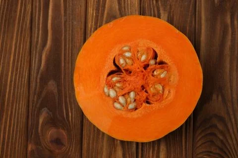 Pumpkin cut in half on the table Stock Photos
