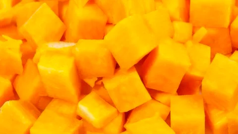 Pumpkin cutted in small square blocks Stock Photos