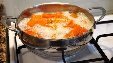 Pumpkin dessert making process. Pumpkin boiling in the pot. Stock Footage 225515484