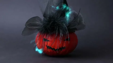 Pumpkin explodes turning into scary Halloween pumpkin with glamorous black hat. Stock Footage 218478124