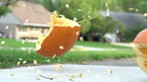 Pumpkin exploding on sidewalk Stock-Footage 12397206
