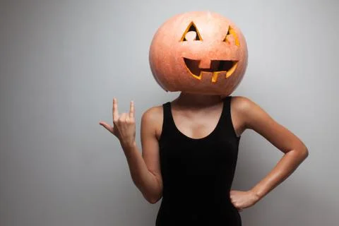 Pumpkin face. dancer standing in halloween costume. Stock Photos