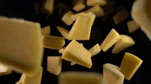 The pumpkin falls into the air on a black background. Slow motion. Stock Footage 82873418