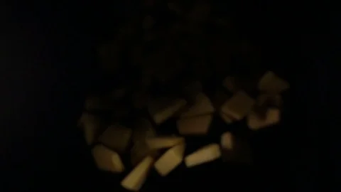 The pumpkin falls into the air on a black background. Slow motion. Stock Footage 82873671