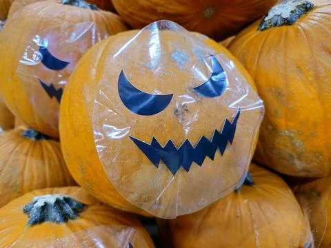 Pumpkin with Halloween packaging Stock Photos