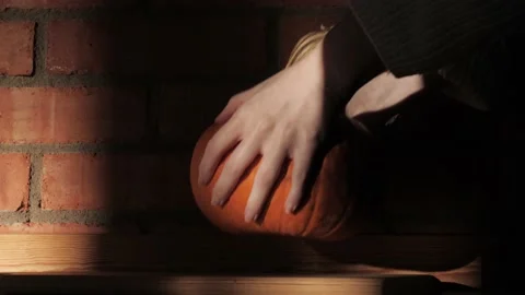 Pumpkin - Hands Picking Up A Pumpkin - Harvest, Halloween, Thanksgiving Concept Stock Footage 130742117
