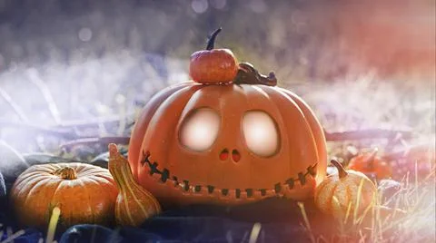 Pumpkin head Jack-o'-lantern close-up and orange autumn pumpkins, still life in Foto stock