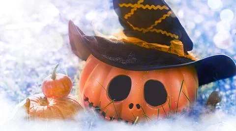 Pumpkin head Jack-o'-lantern close-up and orange autumn pumpkins Stock Photos