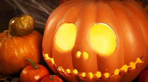 Pumpkin head Jack-o'-lantern and different small pumpkins, cones, acorns and Stock Photos