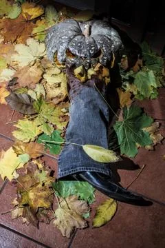 A pumpkin jack eats a man's leg. halloween Stock Photos