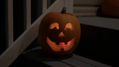 Pumpkin Jack o Lantern on Door Step. Stock Footage 69104931