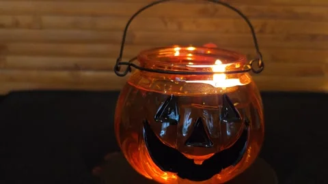 Pumpkin lantern with candle in the dark Stock-Footage 319789269