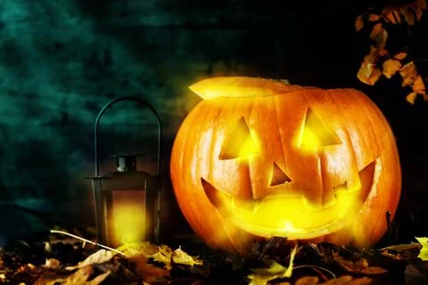 Pumpkin with lantern on dark background Stock Photos