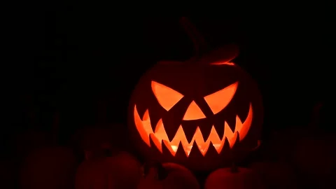 Pumpkin lantern shines with warm light Stock Footage 317983476