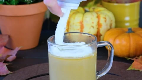 Pumpkin latte. Making a pumpkin latte. Autumn drink. Stock Footage 249108840