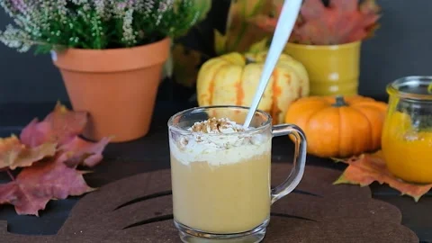Pumpkin latte. Making a pumpkin latte. Autumn drink. Stock Footage 249108844