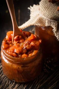 Pumpkin, lemon and apricot kernel jam. Stock Photos