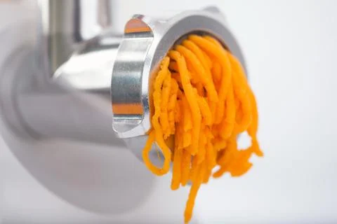 Pumpkin miced with an electrical grinder Stock Photos