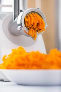 Pumpkin miced with an electrical grinder Stock Photos