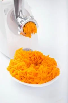 Pumpkin miced with an electrical grinder Stock Photos
