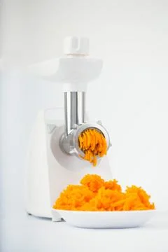 Pumpkin miced with an electrical grinder Stock Photos