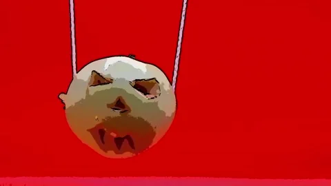 A pumpkin moves against a red background. Stock-Footage 344454704