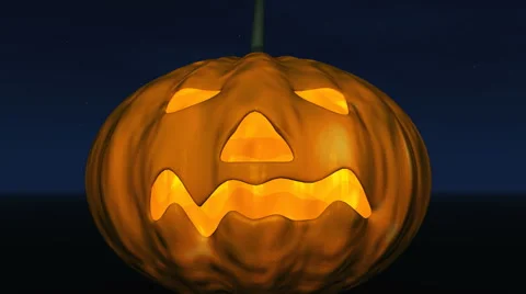 A pumpkin at night with a candle flashing inside Stock-Footage 42112640