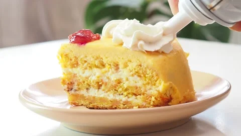 Pumpkin or carrot pie or cake with cream on top Stockbeeldmateriaal 154595700