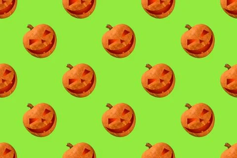 Pumpkin pattern for Halloween on green background Stock Photos
