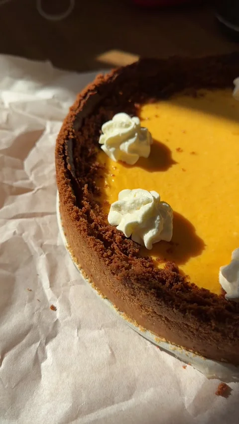 Pumpkin Pie with Cream Decoration in Progress Stock Footage 287348214