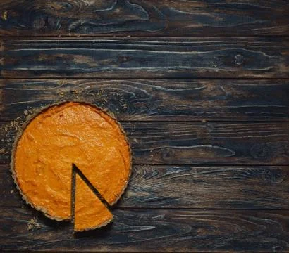Pumpkin pie on dark brown background Stock Photos