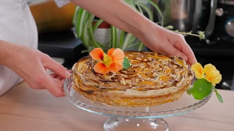 Pumpkin pie decorated with flowers. Stock Footage 253995082