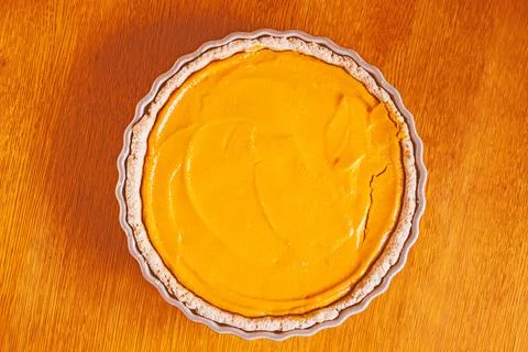 Pumpkin pie, orange cake in a baking dish Stock Photos