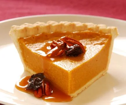 Pumpkin pie with pecans Stock Photos