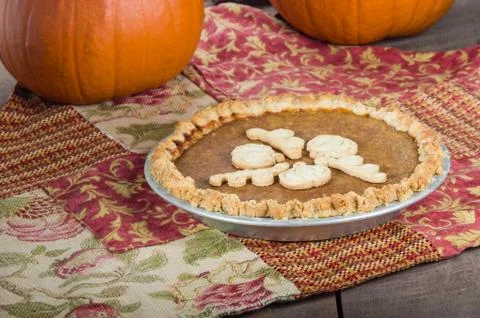 Pumpkin pie with pumpkins Stock Photos