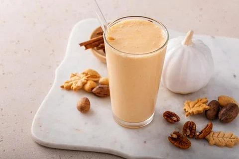 Pumpkin pie smoothie with fall spices and pumpkin puree Stock Photos