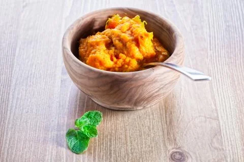 Pumpkin puree with greenery Stock Photos