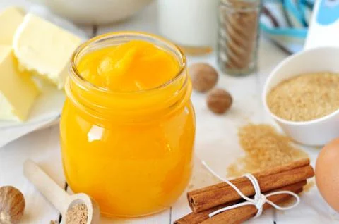 Pumpkin Puree Surrounded with Pumpkin Pie Ingredients 스톡 사진