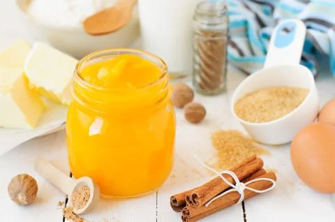 Pumpkin Puree Surrounded with Pumpkin Pie Ingredients Stock Photos