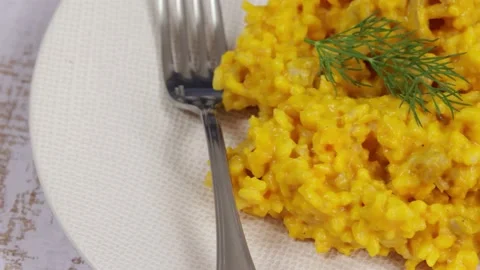 Pumpkin risotto close-up, on a plate Stockbeeldmateriaal 228420219
