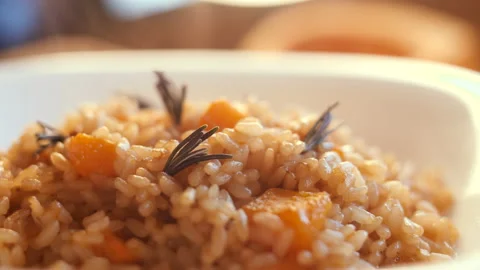 Pumpkin risotto, recipe with rice and pumpkin on rustic table with ingredient Stockbeeldmateriaal 142145278