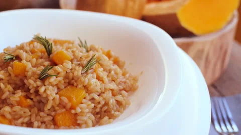 Pumpkin risotto, recipe with rice and pumpkin on rustic table with ingredient Stockbeeldmateriaal 142145682