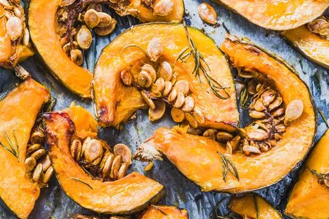 Pumpkin roasted baked background. Stock Photos