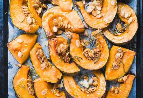 Pumpkin roasted slices background Stock Photos