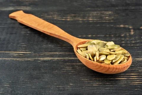Pumpkin seed kernels in spoon Stock Photos