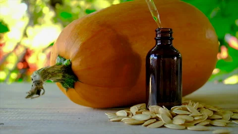 Pumpkin seed oil in a bottle. Selective focus. Stock Footage 162383266