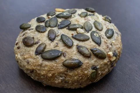 Pumpkin seed rolls bread: Nutritious product of rough grinding. Stock Photos