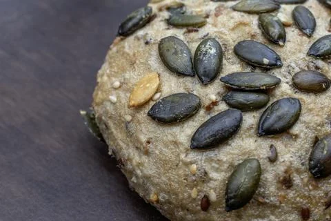 Pumpkin seed rolls bread: Nutritious product of rough grinding. Stock Photos